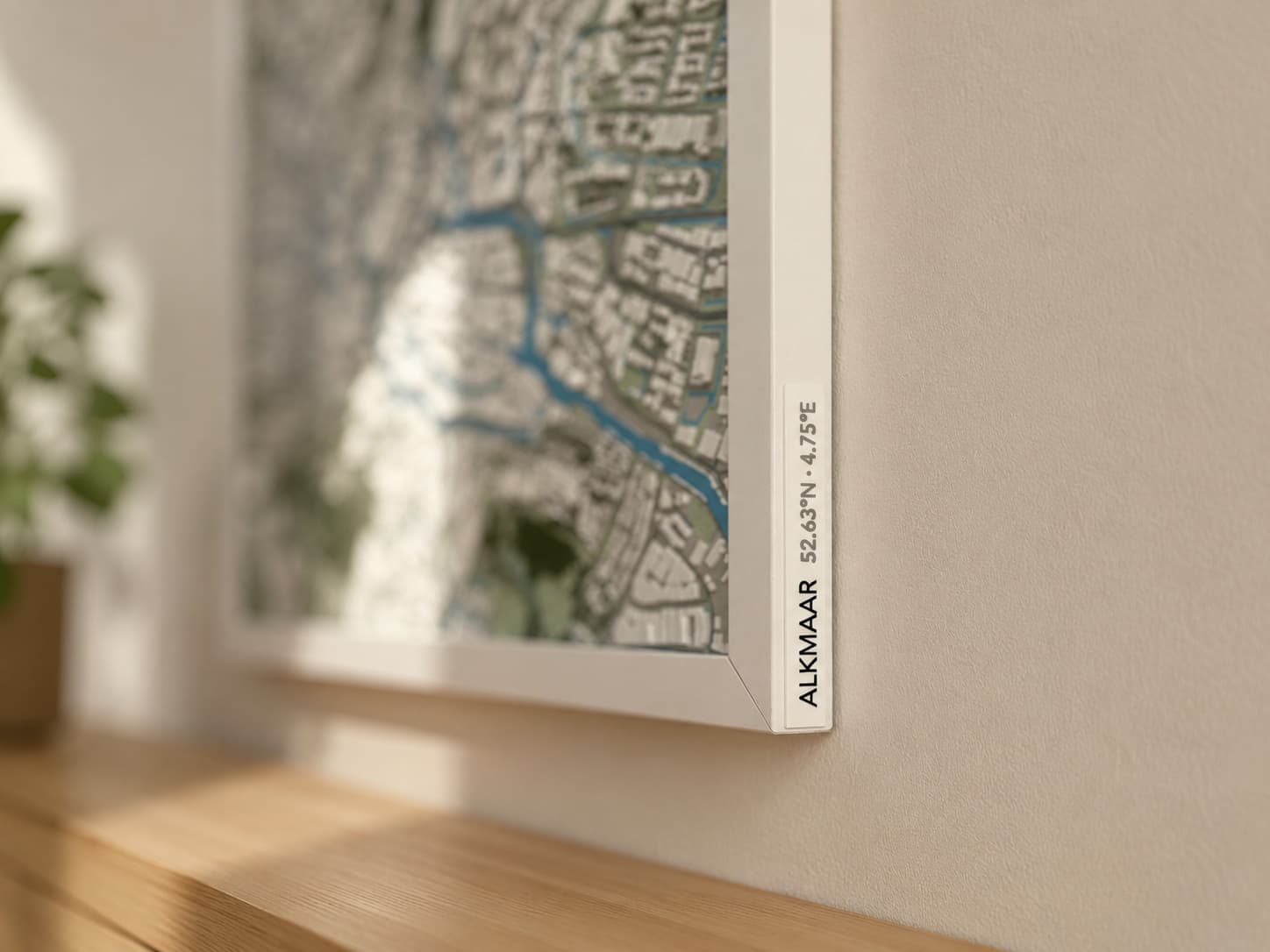 Framed relief map showing the right rail where the place-name plaque is attached.